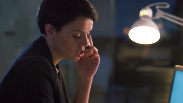 Businesswoman Calling on Cellphone at Night Office 16