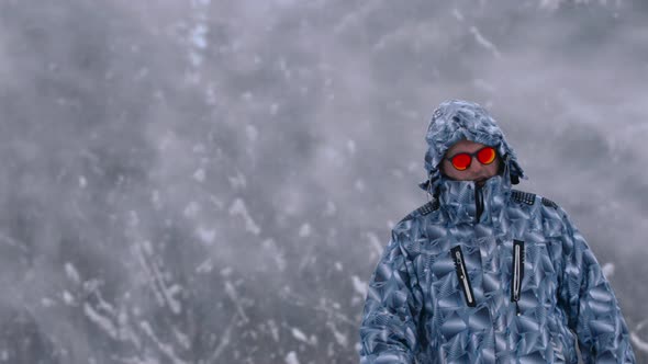 Man Stands Alone Against White Snowstorm and Snow Storm a Snowfall