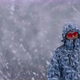 Man Stands Alone Against White Snowstorm and Snow Storm a Snowfall - VideoHive Item for Sale