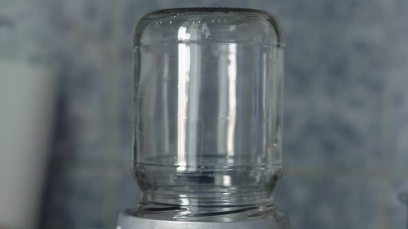 Closeup Glass Jar Sterilized By Steam on a Gas Stove