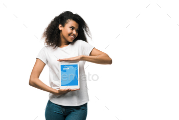 ican girl holding digital tablet with twitter app on