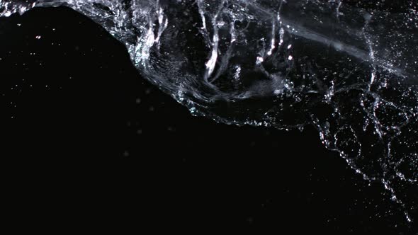 Super Slowmotion Shot of Water Splash Against Black at 1000Fps