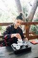 Process brewing tea. Woman steeping herbal tea - PhotoDune Item for Sale