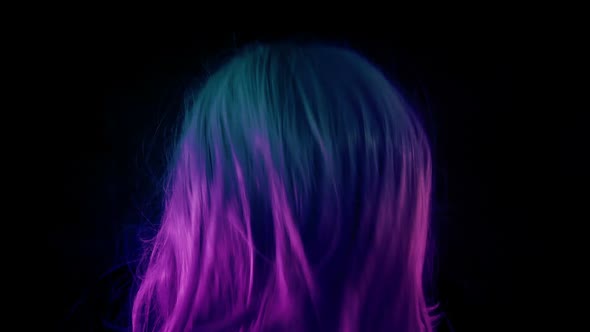 Person Dancing Shaking Hair In Colorful Lights