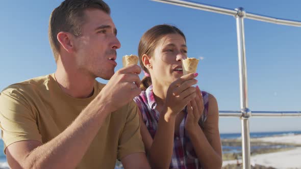 Young adult couple relaxing at the seaside