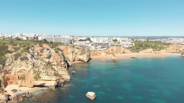 Panoramic view of Lagos, Algarve, seaside beach resort hotels. Orbiting shot