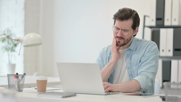 Young Man Toothache Working Laptop