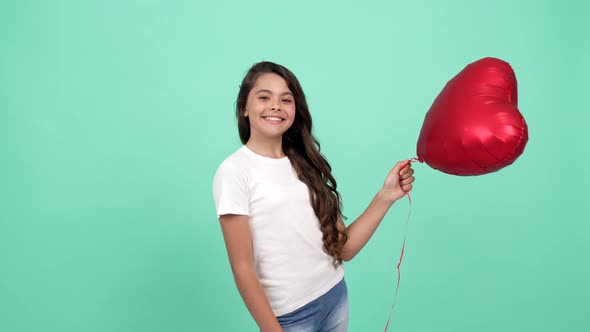 Portrait of Happy Teen Girl Hold Heart Party Balloon Symbol of Charity and Donation Heart Day
