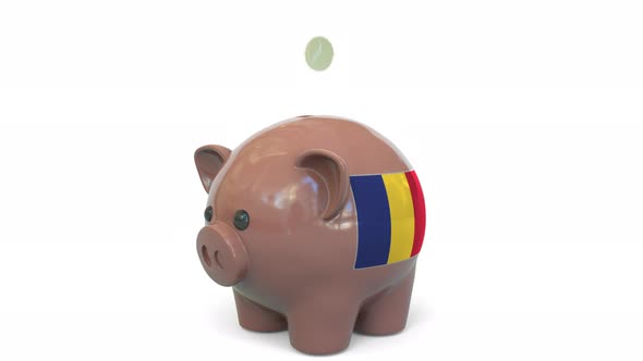 Putting Money Into Piggy Bank with Flag of Romania alt