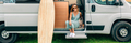 Woman sitting with her dog at the door of her camper van during a trip - PhotoDune Item for Sale