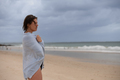 Portrait of woman wrapped with towel at the beach - PhotoDune Item for Sale