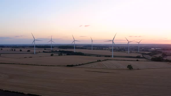 Aerial, drone. energy producing wind turbines. wind energy farm generating electricity. 