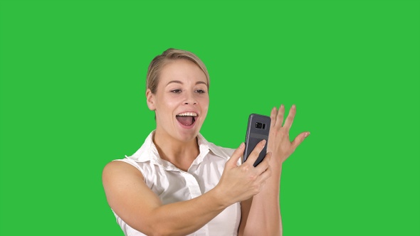 Woman wearing pink making video call on the smart phone