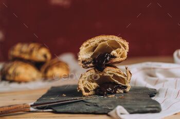 Closeup of Pain au chocolat (chocolatine) pastry with chocolate  on a table