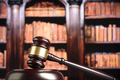 Close up of wooden judge gavel. Blury book library background - PhotoDune Item for Sale