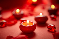 Romantic dinner decoration. Red candles, flower petals, on the table - PhotoDune Item for Sale