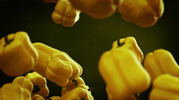 Slow motion animation of natural yellow bell peppers falling down. Loopable. HD