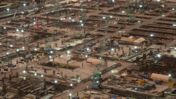 Time lapse of construction site with heavy construction machinery in metropolis