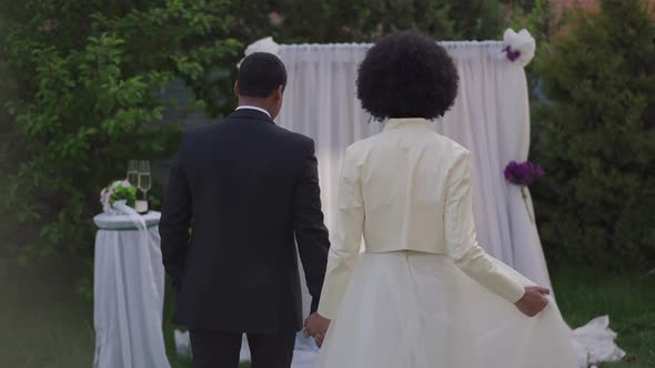 Live Camera Follows Happy Loving Couple Walking in Slow Motion to Wedding Altar Outdoors Turning