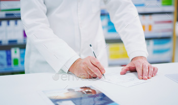 Ill write it down for you. Cropped shot of an unrecognizable pharmacist on a page.