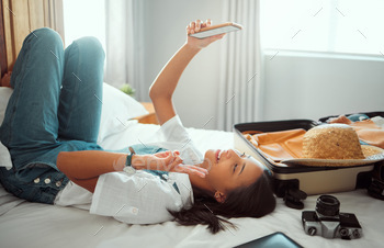 Peace, phone or girl taking selfie on a bed for social media with luggage in airbnb, apartment or h