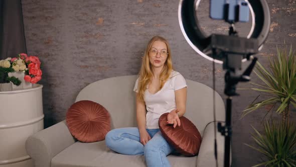 Female Blogger Recording Her Video Using Ring Light and Mobile Phone