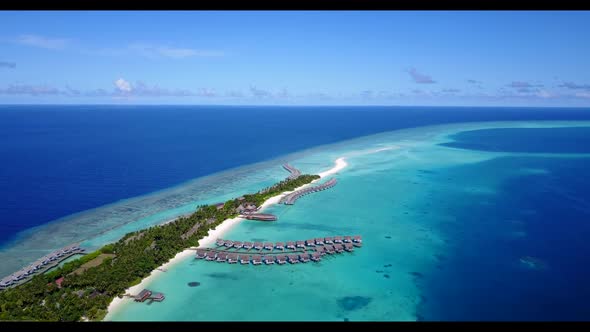 Aerial seascape of beautiful lagoon beach break by turquoise ocean with white sand background of jou