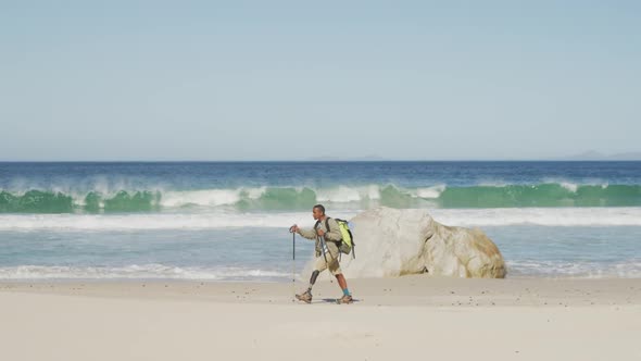 Sporty mixed race man with prosthetic leg hiking