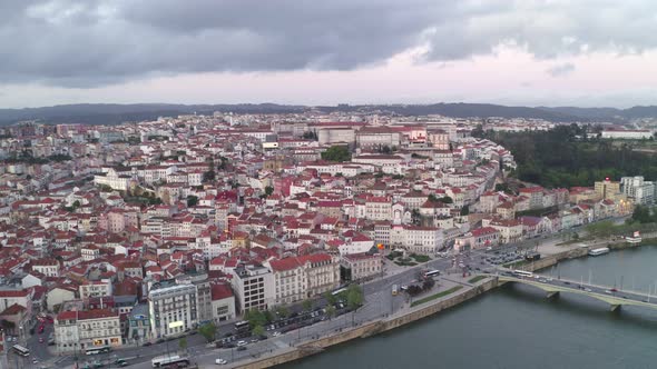 Aerial drone view of Coimbra city and Mondego river at sunset