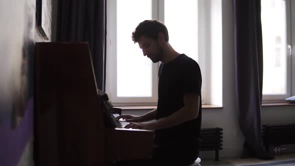 Bearded Man Professionally Play the Piano at Home
