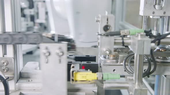 Advanced robotic machine manufacturing parts in an automated assembly line