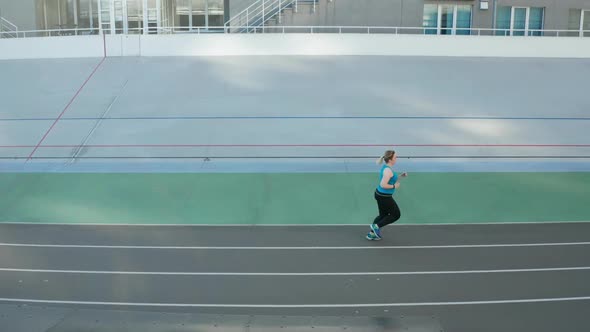 Drone Shot of Overweight Runner During Training