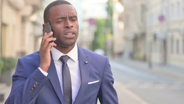 Outdoor African Businessman Talking on Smartphone