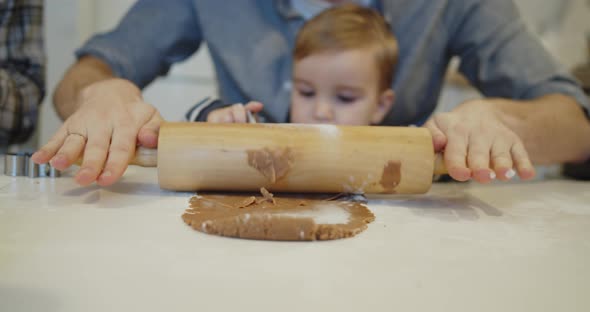 Young Full Family Having Fun Baking Cookies in the Kitchen Together