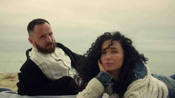 Latina Couple Looking Camera at Sea Beach