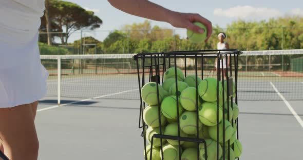 Video of basket with tennis balls on tennis court