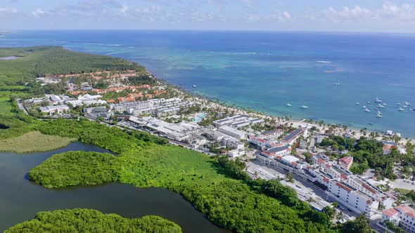 Drone panoramic view of beautiful Laguna Bavaro green wildlife refuge with boats and resorts In Punt
