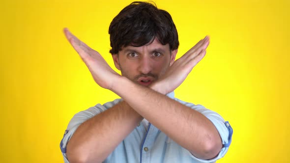 Displeased Worried Young Man Posing Isolated on Yellow Background Studio