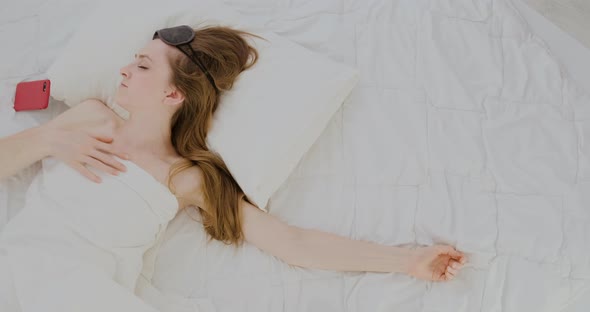 Young Sleeping Woman Cannot Find Comfortable Place in Bed