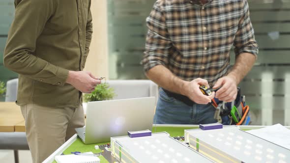 Team of Caucasian Architect Working on House Model Scale Planning Building Project