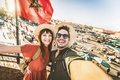 Happy tourists couple visiting Jamaa el-Fna market Marrakech, Morocco  - PhotoDune Item for Sale