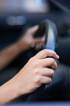 ding onto a steering wheel while driving