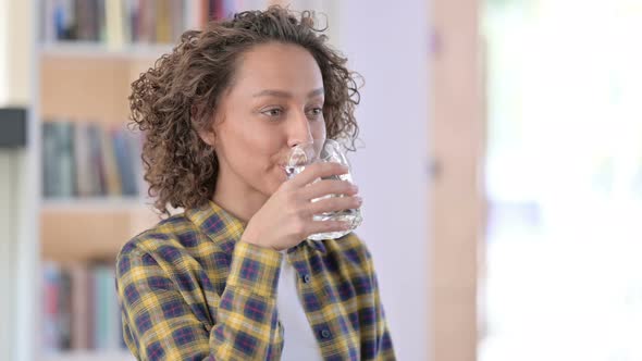 Portrait of Young Mixed Race Woman Drinking Water