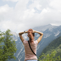View from behind of a young woman enjoying in beautiful nature - PhotoDune Item for Sale