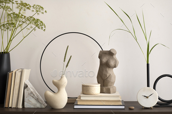 wn commode, sculpture, vase with leaves, books, round clock,  decoration and elegant personal accessories. Modern home decor. Template.