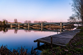 Pier and Enrique Estevan Iron Bridge reflected on the Tormes River at sunset - PhotoDune Item for Sale