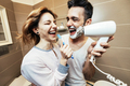 Husband and wife sharing bathroom together at home  - PhotoDune Item for Sale