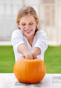 llowing out a pumpkin for halloween