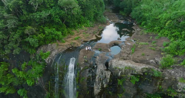 Big Family at the Top of a Big Waterfall