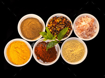 ul spices against a black background